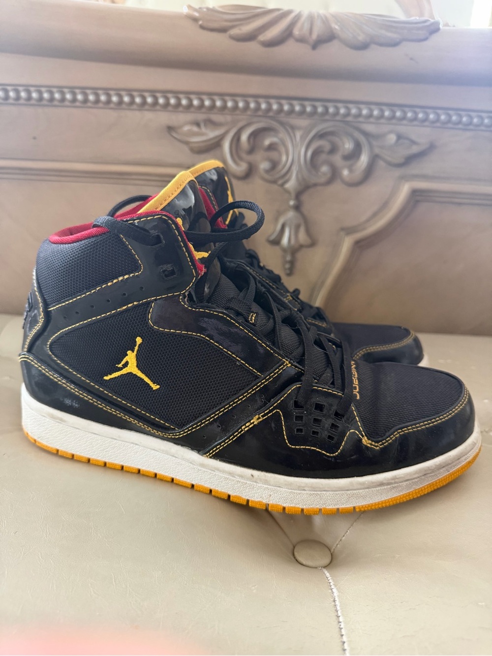Jordan Men’s Black and Yellow Mid-Top Sneakers with Red Lining